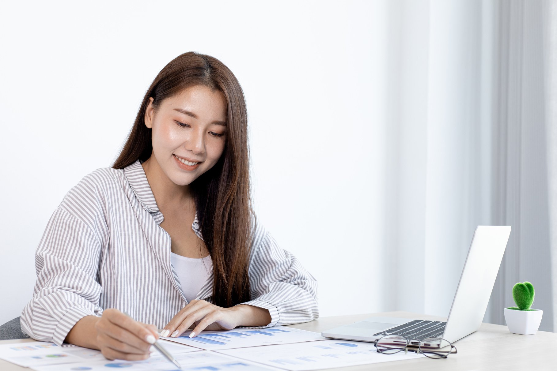 Happy Female Employee Working at the Office